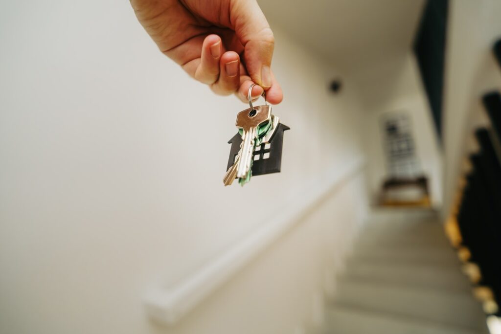 Hand holding keys to a new home